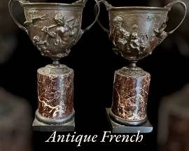 Antique French bronze cups on marble pedestals