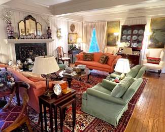 Things to look at carefully:  Vintage Chinoiserie triple panel beveled mirror (over the fireplace) with cheval center mirror; pair of green mohair club chairs; pair of orange Chippendale camelback sofas; antique Orientl rug; MCM nesting tables (4) with embossed leather top