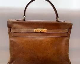Hermes Sac a Depeches - The original “Kelly Bag” before it became the “Kelly Bag” in 1977.  Our team and the exeuctors believe this bag is from the 1950’s.  It has gold initials of the original owner (the homeowner) embossed in gold inside the flap.  She spent her summers in Paris and Venice as a young adult.