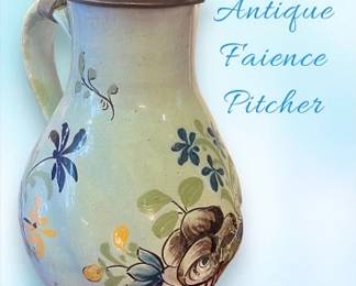 Antique faience pitcher with lid