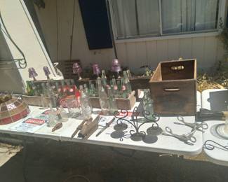 Tons of 3 cent return 1950s soda bottles and wood crates