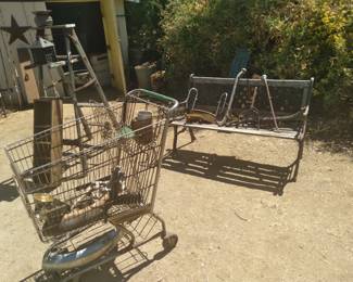 Vintage safeway shopping cart has embossed "S" on sides