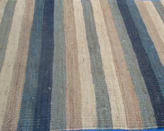 Striped woven rattan area rug 