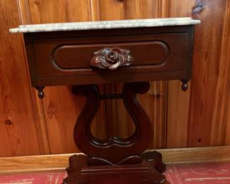 Marble top table with harp base