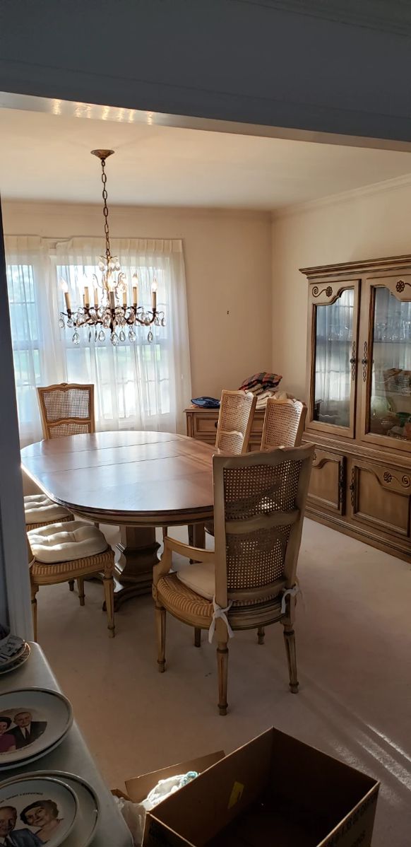 China Cabinet and Dining Table with pad covers to protect wood top.  Six chairs.