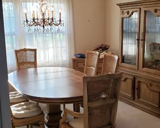 China Cabinet and Dining Table with pad covers to protect wood top.  Six chairs.