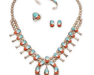 349
A Set Of Effie Calavaza Zuni Silver Set Coral And Turquoise Jewelry
Effie Calavaza (b. 1928, Zuni Pueblo)
Mid/late 20th century
Each stamped: Effie C / Zuni
Four works, each featuring set coral and turquoise stones with applied silver snake motifs, comprising a double-strand squash blossom necklace with twelve snake blossoms suspending a central naja with dangle, with a pair of matching earrings, as well as a narrow cuff bracelet with oblong stones and stamped terminals, as well as a large ring, 5 pieces
Necklace: 22.5" L x 2.5" H; cuff: 6.5" inner C x 0.25" H, with a 1.25" gap; ring size: 10; each earring: 0.75" H
135.3 grams gross
Estimate: $800 - $1,200