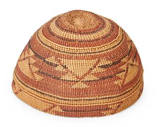 118
A Hupa/Yurok/Karuk Polychrome Basketry Hat
Early 20th century; Northern California
The twined hat with imbricated red and brown banded stripe and geometric motifs
3.625" H x 6.625" Dia.
Estimate: $500 - $700