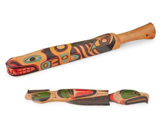 185
Two Northwest Coast Carved Wood Items
Two works:

Tom Williams (b. 1962, Squamish)
A polychrome wood bird plaque, 1985
Incised signature and date verso: Tom Williams
The carved wood wall plaque with red, green, and black pigments, depicting a totemic-style bird figure with heads at each end
14.25" H x 2.375" W x 0.625" D

A Northwest Coast polychrome wood fishing club, early/mid-20th century
Unmarked
The club depicting an orca with teeth bared and a raven on its back, decorated with green, red, and black pigments
19.125" L x 2.75" W x 1.875" D

2 pieces
Estimate: $200 - $300