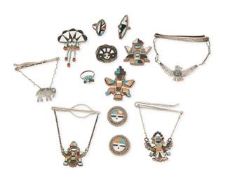 475
A Group Of Southwest Silver And Stone Inlay Jewelry
Early/mid-20th century
One ring stamped: Boone
A large group of Zuni stone set jewelry comprising two Knifewing brooches with turquoise and stone inlay, two "pendant" Knifewing tie clips, a sunface pendant/brooch with mother of pearl and coral inlay, three smaller brooches with sunface motifs, three rings with mulitstone inlay, and two further Southwest pendant tie clips, one a thunderbird and one an elephant, 13 pieces
Largest: 3.5" H x 3" W (tie clip); smallest: 1" Dia. (pin); Rings: sizes 5.5 & 5
115.7 grams gross
Estimate: $500 - $700