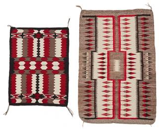 230
Two Navajo Weavings
Mid-20th century, Diné
Comprising a pictorial rug woven in red, black, cream, and natural grey wool, depicting an elongated stepped motif, and a Ganado saddle blanket woven in deep red, black, cream, and brown/grey wool, with banded lozenge and zig zag motifs
2 pieces
Larger: 33.5" H x 50" W; Smaller: 27" H x 35.5" W
Estimate: $400 - $600