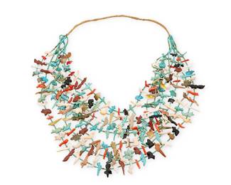 339
A Zuni Pueblo Carved Hardstone Fetish Necklace
Mid/late 20th century
A seven-strand necklace of carved stone animals in multiple colors including foxes, bears, birds, turtles, frogs, and fish, and with fine turquoise bead spacers and a wrapped neck cord
26" L approximately at narrowest point
Estimate: $800 - $1,200