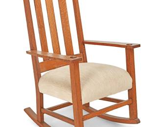 42
A Limbert's Arts And Crafts Oak Rocking Chair, No. 810
Circa 1906-1920; Michigan
With burn mark under left armrest: Limberts Arts and Crafts Furniture / Made in Grand Rapids and Holland
The quarter-sawn oak slat back armchair with three slats over a later upholstered and cushioned seat atop a medial stretcher and four square legs raised on rockers
40" H x 25.5" W x 29.5" D
Estimate: $400 - $600