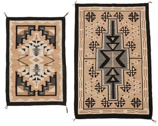 229
Two Navajo Regional Rugs
Mid/late 20th century, Diné
Each woven in cream, beige, black, and grey wool, the larger with elongated stepped central diamond with floating elements, the other with various geometric and stepped motifs and a stepped border
2 pieces
Larger: 39" H x 60.5" W; Smaller: 30.5" H x 46.5" W
Estimate: $400 - $600