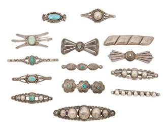 419
A Group Of Southwest Silver Brooches
Early/mid-20th century
Two marked for sterling; one further marked: Spratling Silver / Mexico [for First Design Period]
Comprising a large group of brooches in various sizes and designs, eight with set turquoise and green stone, as well as one rectangular repoussé hair clip, 14 pieces
Largest: 0.75" H x 3" W; smallest: 0.625" H x 1.5" W
96.1 grams gross
Estimate: $200 - $400
