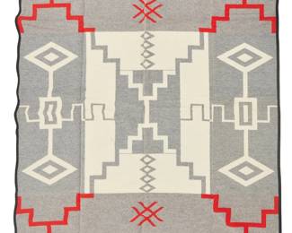 238
A Pendleton "Babbitt Brothers 100th Anniversary" Blanket
1989
Edition: 430/1000
Numbered to Babbitt Brothers 100th Anniversary tag; With Pendleton cloth tag; also with original bi-fold paper tag with original plastic fastener: Pendleton Indian Blankets / A Warm and Colorful Heritage / Pattern number: Z494 / Color number: 165 / 82% filling (pure virgin wool) / 18% warp (spool spun cotton)
Designed by Jim Babbitt (1948-2021), the reversible blanket woven in red, black, grey, and cream wool, with a central Navajo-style Storm Pattern motif and water bug motifs at edges, housed in original box
Blanket: 64" H x 80" W; Box: 5" H x 21" W x 17.5" D
Estimate: $200 - $400