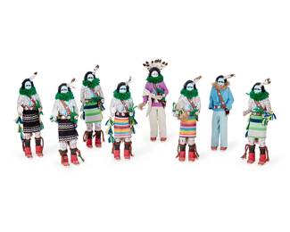 326
A Group Of Navajo Yei Bi Chei Kachina Dolls
Late 20th century
Each unmarked
The polychrome carved wood dancer figures, each adorned in various patterned fabrics, leather, beads, and string, headpieces mounted with feathers, and depicted holding a rattle in one hand and corn stalk in the other, comprising seven with blue faces and one with white
8 pieces
Each: 10" H x 3.5" W x 2" D approximately
Estimate: $300 - $500