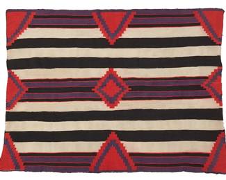 196
A Navajo Germantown Third Phase Wearing Blanket
Late 19th century, Diné
A fine plied wool of red, purple, cream and dark brown/black wool
51" H x 69" W
Estimate: $2,000 - $4,000
