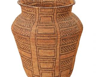 135
A Large Apache Olla Basket
Early 20th century; Southwest United States
The tall basketry olla with alternating columns of stacked checkered and empty squares
16.25" H x 12.75" Dia.
Estimate: $1,000 - $2,000