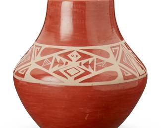 344
Helen Gutierrez (1930-1995, San Ildefonso Pueblo)
A redware pottery vessel, mid-20th century
Marked to the underside: Helen Gutierrez / San Ildefonso
The clear glazed vessel featuring banded motifs, one side depicting feathers, the other half depicting geometric motifs and an animal figure
6.25" H x 5.5" Dia.
Estimate: $200 - $300