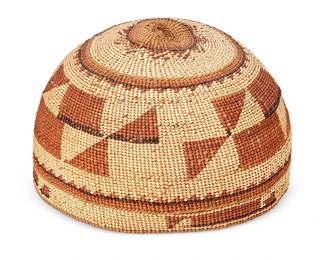 123
A Hupa/Yurok/ Karuk Polychrome Basketry Hat
Early 20th century; Northern California
The twined hat with imbricated brown and orange banded stripe and geometric motifs
3.875" H x 6" Dia.
Estimate: $400 - $600