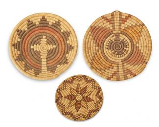 139
Three Hopi Pueblo Polychrome Basketry Plaques
Mid-20th century; Southwest United States
The coiled basketry trays comprising a smaller wedding basket and a two plaques with central floral motifs
3 pieces
Largest: 14.75" Dia.; Smallest: 8" Dia.
Estimate: $300 - $500