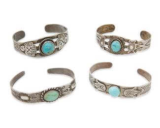 414
A Group Of Fred Harvey Silver And Turquoise Cuff Bracelets
Early/mid-20th century
One marked for sterling; one marked: Silver / Mexico
Four narrow ornate silver and set turquoise and blue stone cuffs, all in various styles and sizes, with motifs including stampwork, thunderbirds, arrowheads, and arrows, 4 pieces
Largest: 6.5" inner C x 0.875" H, with a 1.25" gap; smallest: 6.25" inner C x 0.5" H, with a 1" gap
78.2 grams gross
Estimate: $400 - $600