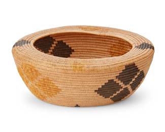 127
A Panamint Polychrome Basket
Early 20th century; Central California
The coiled basketry bowl with flat shoulder rim, central floral motif at center, and stepped diamonds to the body alternating in yellow and brown
4.5" H x 12.625" Dia.
Estimate: $700 - $900
