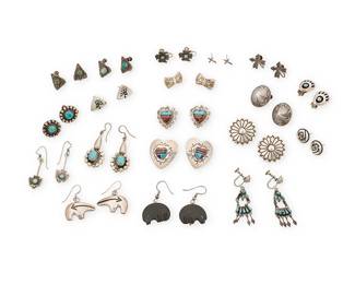 463
A Group Of Southwest Silver Earrings
Mid/late 20th century
Comprising nineteen pairs of sterling silver and set turquoise and stone inlay earrings, by various makers in various styles and motifs including two pairs in Hopi overlay by Ramon Dalangyawma, and other styles such as Zuni petit point, Fred Harvey, bear paw, thunderbirds, hearts, conchos, heartline bears, and arrowheads, 38 pieces
Largest: 2" H; smallest: 0.375" H
92.3 grams gross
Estimate: $200 - $400