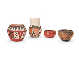 329
Four Hopi And Pueblo Pottery Vessels
Four works:

Evelyn Poolheco (1916-1989, Hopi-Tewa)
A polychrome pottery vase, mid/late 20th century
Marked to the underside: E. Poolheco
The three-color vase with brown and red wave and mountain motifs over white
5.5" H x 3.625" Dia.

A polychrome pottery jar, late 20th century
Marked to underside: A. Gachupin
Possibly Antonia Gachupin (b. 20th century, Jemez Pueblo), the three-color jar with red and black banded feather and kiva step motifs and white slip interior
4.25" H x 5" Dia.

Two diminutive pottery bowls, mid/late 20th century
One with penciled mark to underside: Hopi
Comprising a small redware bowl with black hooked motif at rim, and a small bowl with three-color geometric motifs, 2 pieces
Larger: 3" H x 4.25" Dia.

4 pieces total
Largest: 5.5" H x 3.25" Dia.
Estimate: $300 - $500