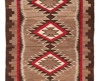 212
A Navajo Regional Rug
Early 20th century, Diné
Woven in light and dark brown, red, and cream wool, with a column of four serrated diamonds and a stepped border
38.5" H x 62" W
Estimate: $400 - $600