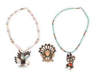 479
A Group Of Zuni Silver And Inlay Jewelry
Mid-20th century
Each unmarked
Three works with multistone inlay comprising an eagle pendant/brooch with turquoise, shell and jet inlay suspended from a silver bead necklace (17" L x 2.25" H), a chief's head pendant/brooch with feather headdress in shell, coral, and turquoise inlay, and a coral, turquoise, and shell inlay dancer pendant on a multistone bead necklace (18.5" L x 2.25" H), 3 pieces
97.9 grams gross
Estimate: $500 - $700