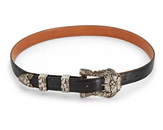 444
A Julia Martinez Navajo Sterling Silver Ranger Belt Set
Julia Martinez (b, 20th century, Diné)
Stamped to buckle: JJM [stacked, in box]; belt: Max Lang/Houston Texas
An elaborate silver ranger set with multiple stamped and applied silver floral and feather motifs, comprised of a buckle, two keepers and a tip, all mounted to a black lizard belt
Buckle: 2.125" H x 2.75" W; each keeper: 1.125" H; tip: 1" H; belt: 36" L x 1" H
Buckle and keepers only: 63.0 grams
152.0 grams gross
Estimate: $400 - $600