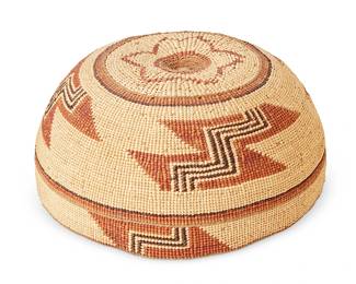 114
A Hupa/Yurok/Karuk Polychrome Basketry Hat
Early 20th century; Northern California
The twined hat with imbricated brown, orange, and tan banded stripe and geometric motifs, with star to top
3.125" H x 6.875" Dia.
Estimate: $600 - $800