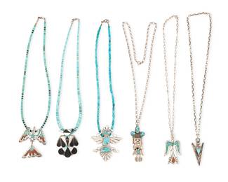 478
A Group Of Southwest Silver And Stone Set Jewelry
Mid/late 20th century
Four marked for artist; one marked for sterling
etched: A. Dishta / Zuni; R.E. Zuni; JTS [for Juan Singer, Navajo/Diné]
Six necklaces, with three suspended from turquoise strands, and three from silver chains, comprising four silver and set stone pendant/brooches in various motifs including an A. Dishta Zuni stone inlay thunderbird, a Juan Singer Navajo/Diné mosaic inlay peyote bird, a signed turquoise set katsina figure, and a heavy cast silver stylized kachina figure with set turquoise, together with a mosaic peyote bird pendant and an RE Zuni arrow motif pendant with set turquoise, 6 pieces
Largest: 2.375" H x 2.125" W; smallest: 2" H x 0.75" W; necklaces: 24" L to 17" L
124.7 grams gross
Estimate: $800 - $1,200