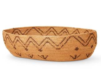 128
A Paiute Basket
Early 20th century; Central California
The coiled basketry oval bowl with zig zag motif to rim and arrows at body
4.125" H x 16.25" W x 11.875" D
Estimate: $500 - $700