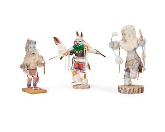 319
Three Hopi Katsina Figures
Three works:

Raymond Parkett (b. 20th century, Hopi-Tewa)
A wolf katsina figure holding a rattle, late 20th/early 21st century
Signed and inscribed to underside: The Wolf / Raymond Parkett
Polychrome carved cottonwood, feathers, fur, and stone
Overall: 13.5" H x 5.5" W x 6.25" D

A wolf katsina figure with bow and arrow, late 20th/early 21st century
Marked to underside: wolf; further marked illegibly
Polychrome carved cottonwood, hide, fur, stone, feathers, and beads
Overall: 17" H x 9.75" W x 8" D

An eagle katsina figure, late 20th/early 21st century
Marked to underside: Wolf; signed illegibly
Polychrome carved cottonwood, hide, fur, feathers, and cotton
Overall: 15.25" H x 15" W x 12.5" D

3 pieces
Estimate: $200 - $400