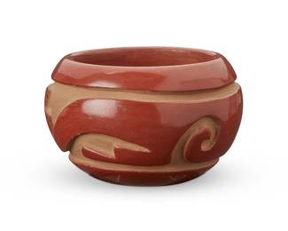 372
Joy Cain ( B. 1947, Santa Clara Pueblo)
A redware pottery bowl, late 20th century
Marked to the underside: Joy Cain / Santa Clara Pueblo
With deeply incised whirlwind and stepped motifs
3" H x 4.5" Dia.
Estimate: $100 - $200