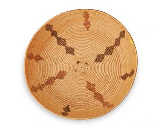 125
A Panamint Polychrome Basket
Early 20th century; Central California
The coiled basketry low bowl with columns of stacked diamond motifs
4" H x 14.5" Dia.
Estimate: $700 - $900