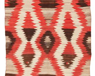 208
A Navajo Regional Rug
Early 20th century, Diné
Woven in red, cream, grey, and dark brown wool, with alternating conjoined and floating serrated diamond motifs
41" H x 58" W
Estimate: $400 - $600