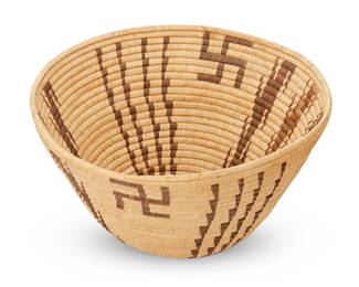 124
A Panamint Basket
Early 20th century; Central California
The coiled basketry bowl with whirling log and geometric column motifs
7" H x 13.5" Dia.
Estimate: $1,200 - $1,800
