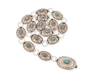 441
A Southwest Sterling Silver Link Concho Belt
Mid/late 20th century
Stamped: Sterling / [unknown pictographs: arrow, sun, circle]
A belt comprised of multiple elaborately incised and stamped silver oval concho links with a larger oval buckle, each with central set turquoise
34.5" L to 31.5" L x 1.125" H; buckle: 1.625" H
144.7 grams gross
Estimate: $500 - $700