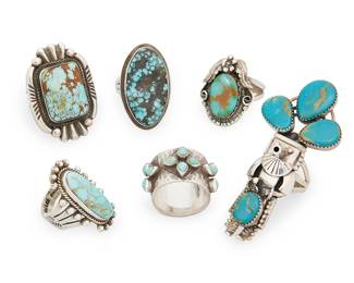 455
A Group Of Southwest Silver And Turquoise Rings
Mid/late 20th century
Three marked for artist; four marked for Sterling
Six rings in various styles and sizes in silver with set turquoise including Navajo rings by Calvin Martinez (b.1960, Diné) and Albert Jake (b. 1959, Diné), a Hopi-style kachina ring with turquoise headdress, a wide cluster-set sterling silver band, and an oval heavy matrix turquoise ring, 6 pieces
Largest ring size: 8; smallest ring size: 6.75
85.3 grams gross
Estimate: $600 - $800