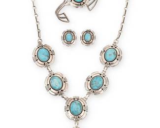 368
A Set Of Southwest Sterling Silver And Turquoise Jewelry
Late 20th century
Each stamped: Sterling; two further stamped: TW [Possibly Terry Williams, Navajo/Diné]
Three works comprising a shadowbox sterling silver pendant link necklace with set blue hardstone cabochons, together with a matching three-wire cuff bracelet and a pair of earrings, 4 pieces
Necklace: 22.5" L x 3" H; cuff: 6.75" inner C x 1.5" H, with a 1.25" gap; each earring: 1" H
152.9 grams gross
Estimate: $600 - $900