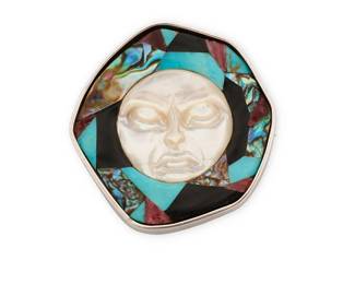 335
A Sussy-Rose Shields Sterling Silver And Stone Inlay Brooch
Late 20th/21st century
Stamped: Sussy / Sterling
A Northwest Coast-inspired asymmetrical brooch with a carved mother of pearl central face surrounded by a cobblestone inlay of abalone, turquoise, onyx and spiney oyster
1.75" H x 1.625" W
28.4 grams gross
Estimate: $200 - $400