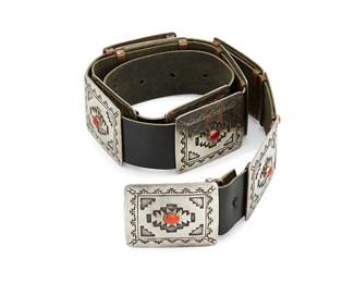 432
An Emerson Kinzel Navajo Sterling Silver And Coral Concho Belt
Emerson Kinzel (b. 20th century, Diné)
Late 20th century
Comprised of ten rectangular conchos and a matching buckle, each with stepped diamond blanket-style motifs and a central coral cabochon, all mounted to a black leather belt strap
Buckle and each concho: 2" H x 2.375" W; strap: 40.5" L x 1.5" H
487.2 grams gross
Estimate: $1,000 - $1,500