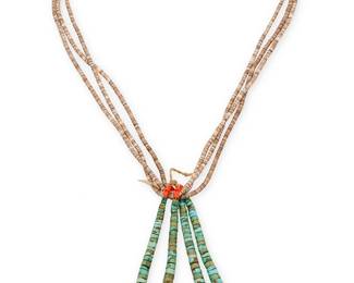 338
A Southwest Pueblo Turquoise And Heishi Necklace
Mid-20th century
A three-strand heishi shell bead necklace suspending two turquoise jaclas with coral and clam shell beads
24" L x 5" H
Estimate: $400 - $600