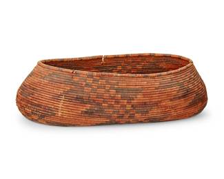 131
A Pomo Basket
Early 20th century; Central California
The coiled basketry oval bowl with banded checkered and geometric motifs
3.625" H x 12.875" W x 7.375" D
Estimate: $600 - $800