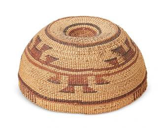119
A Hupa/Yurok/Karuk Polychrome Basketry Hat
Early 20th century; Northern California
The twined hat with imbricated brown, red, and orange banded stripe and geometric motifs
3.25" H x 6.875" Dia.
Estimate: $400 - $600
