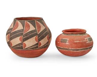 373
A Pair Of Pueblo Pottery Vessels
20th century
One marked to the bottom: NS 113
Comprising a three-color olla form jar with geometric motifs to shoulder and body above a terracotta wash and puki indentation to underside, and a smaller three-color vessel with hooked rectangular motifs and banded flared rim
2 pieces
Larger: 5.75" H x 6.75" Dia. ; Smaller: 4" H x 5.5" Dia.
Estimate: $200 - $400